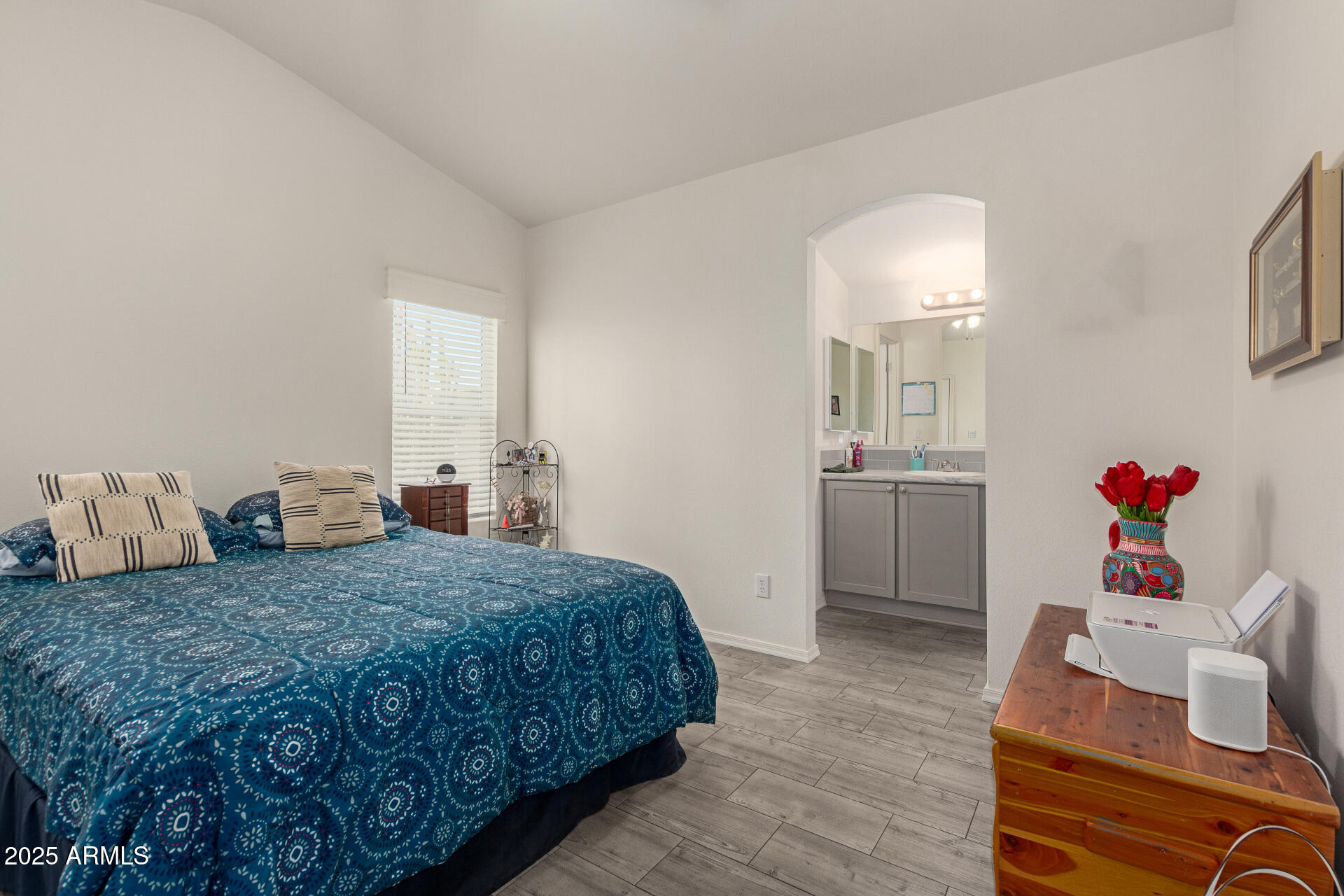 10540 East Apache Trail, Unit 50 Apache Junction, AZ 85120 - Photo 19 of 32 a bedroom with a bed and a view of kitchen