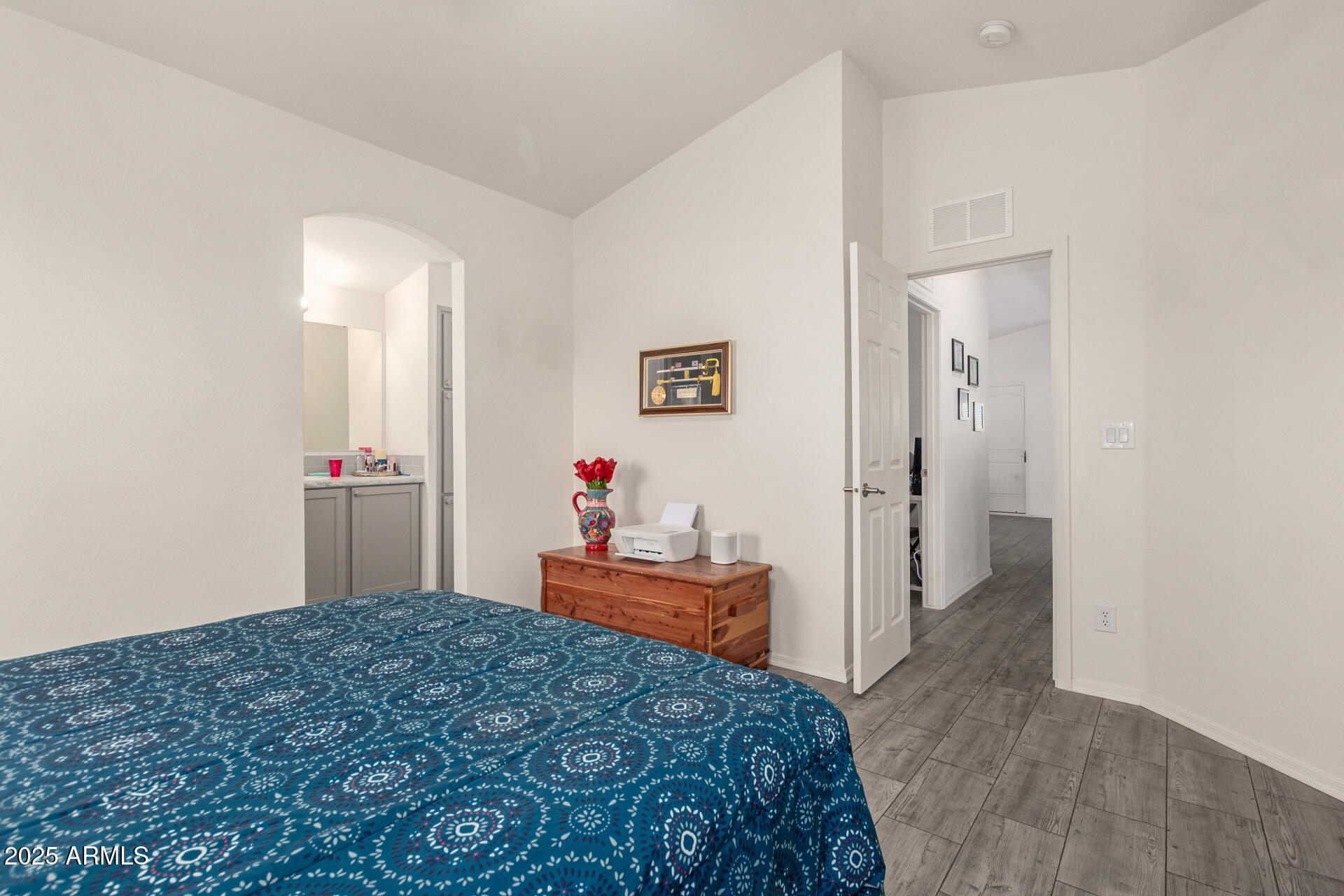 10540 East Apache Trail, Unit 50 Apache Junction, AZ 85120 - Photo 20 of 32 a bedroom with a bed and a mirror