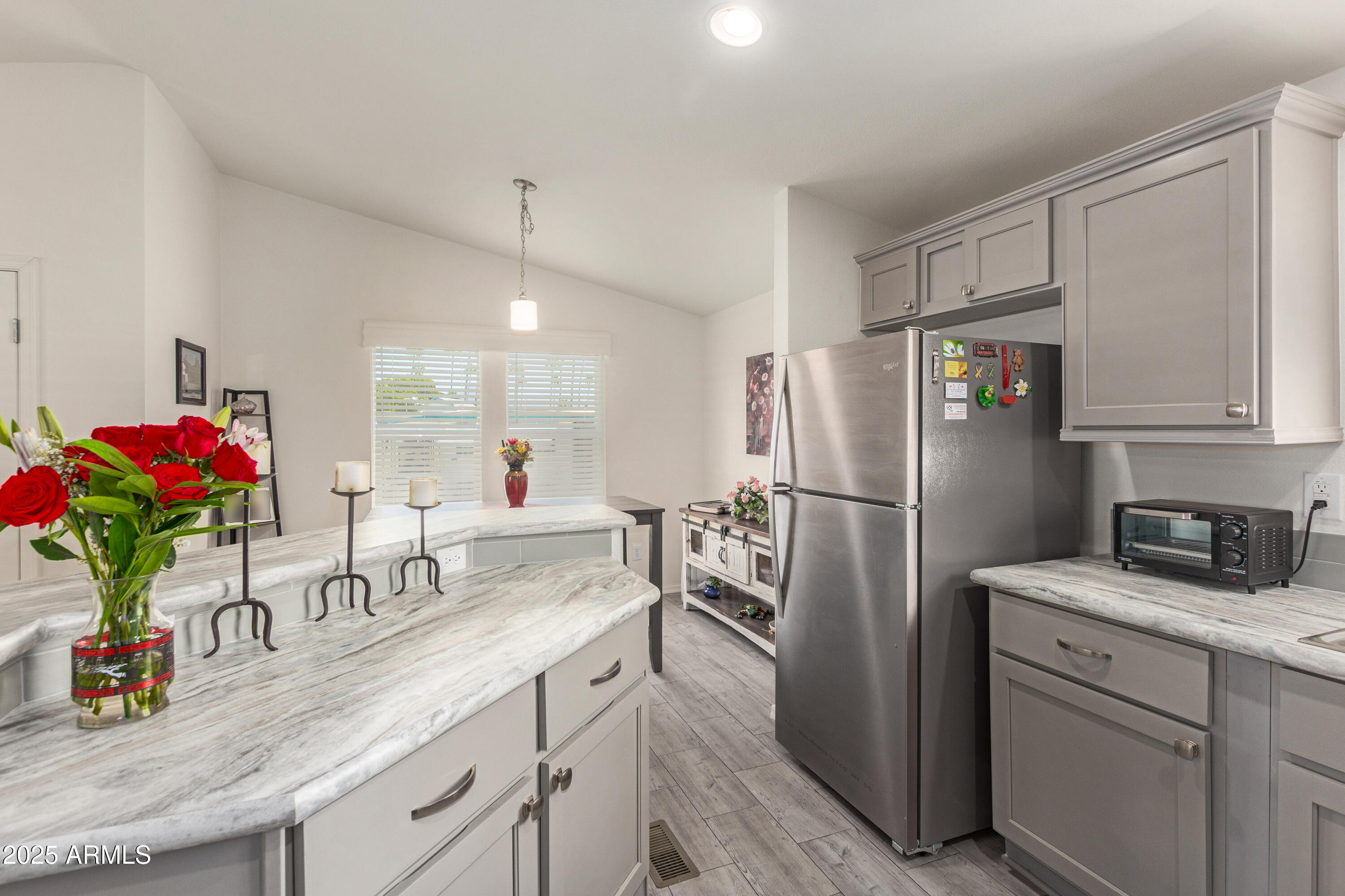 10540 East Apache Trail, Unit 50 Apache Junction, AZ 85120 - Photo 2 of 32 a kitchen with refrigerator a sink and cabinets