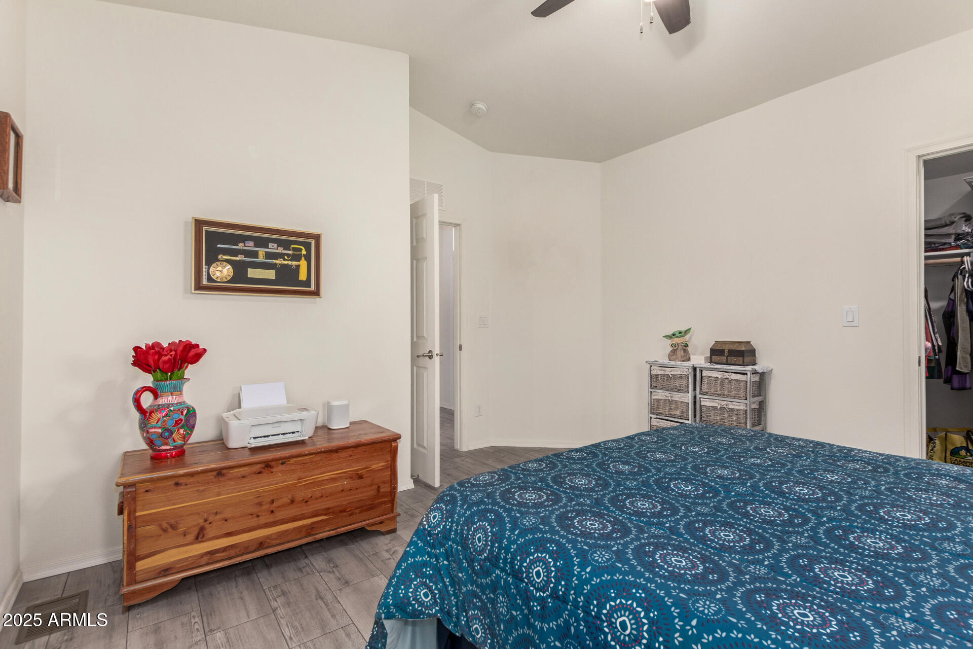 10540 East Apache Trail, Unit 50 Apache Junction, AZ 85120 - Photo 21 of 32 a bedroom with a bed and cabinets