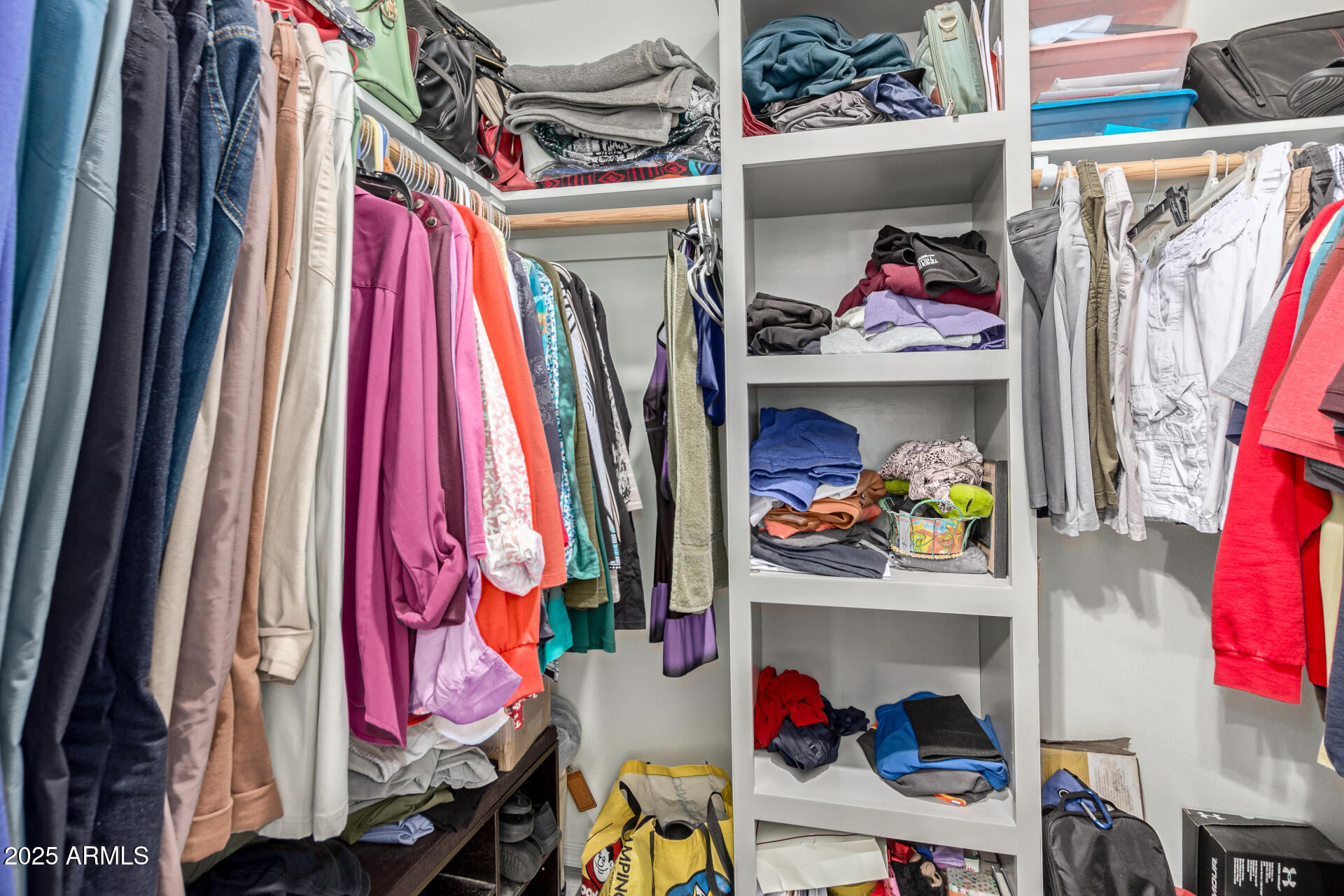 10540 East Apache Trail, Unit 50 Apache Junction, AZ 85120 - Photo 23 of 32 a view of walk in closet with clothes and shoes