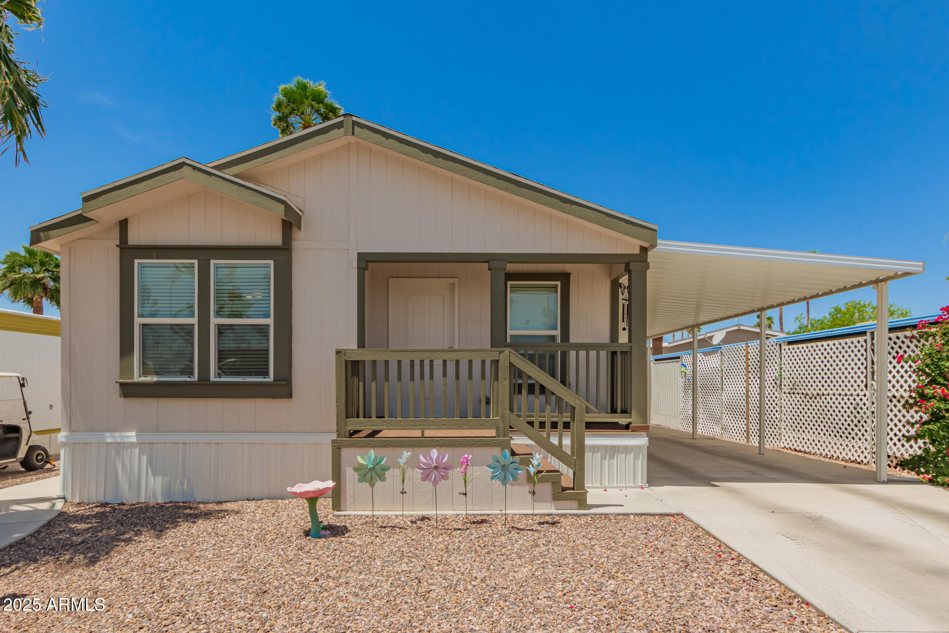 10540 East Apache Trail, Unit 50 Apache Junction, AZ 85120 - Photo 5 of 32 a view of a house with wooden fence