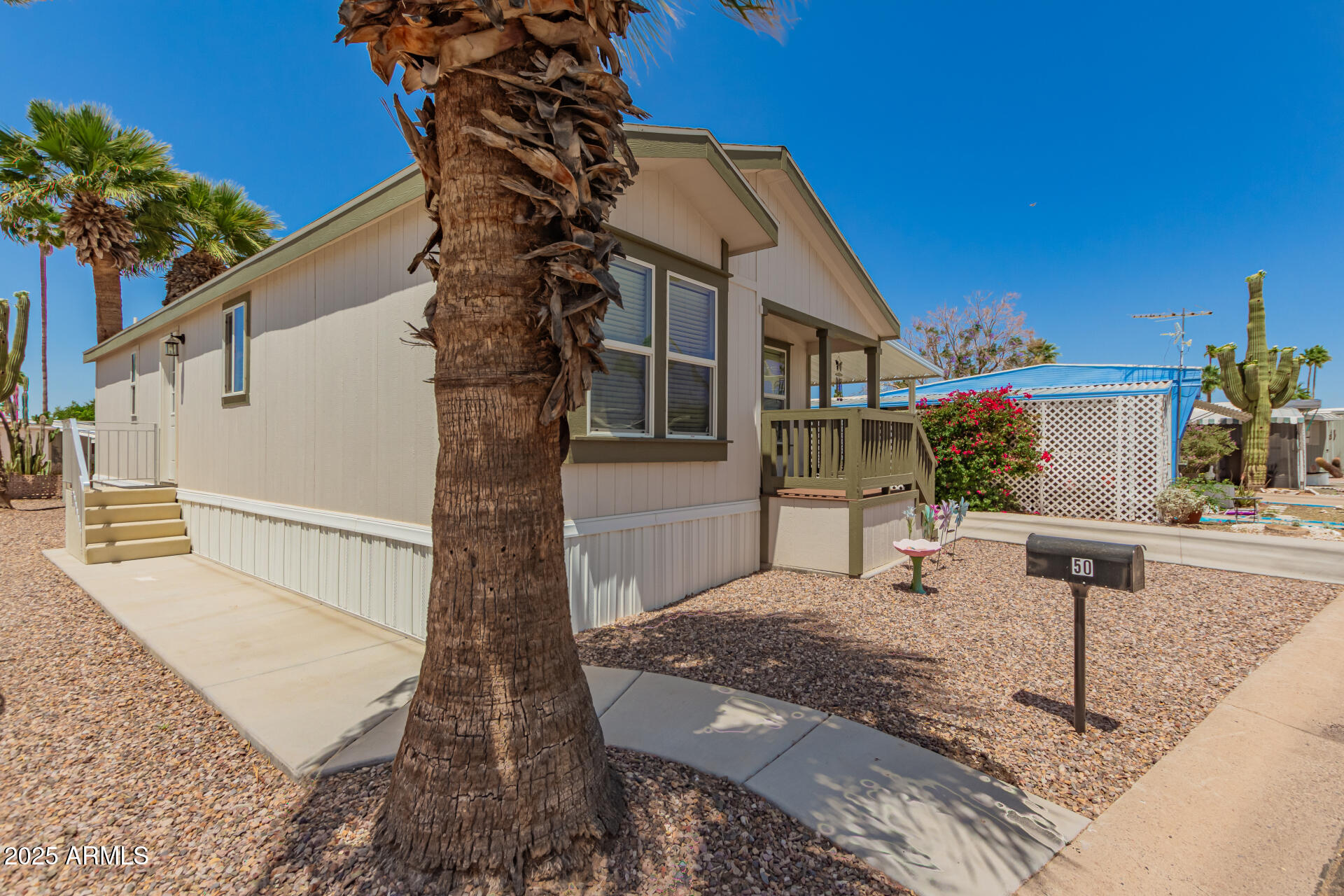 10540 East Apache Trail, Unit 50 Apache Junction, AZ 85120 - Photo 6 of 32 a front view of a house with street