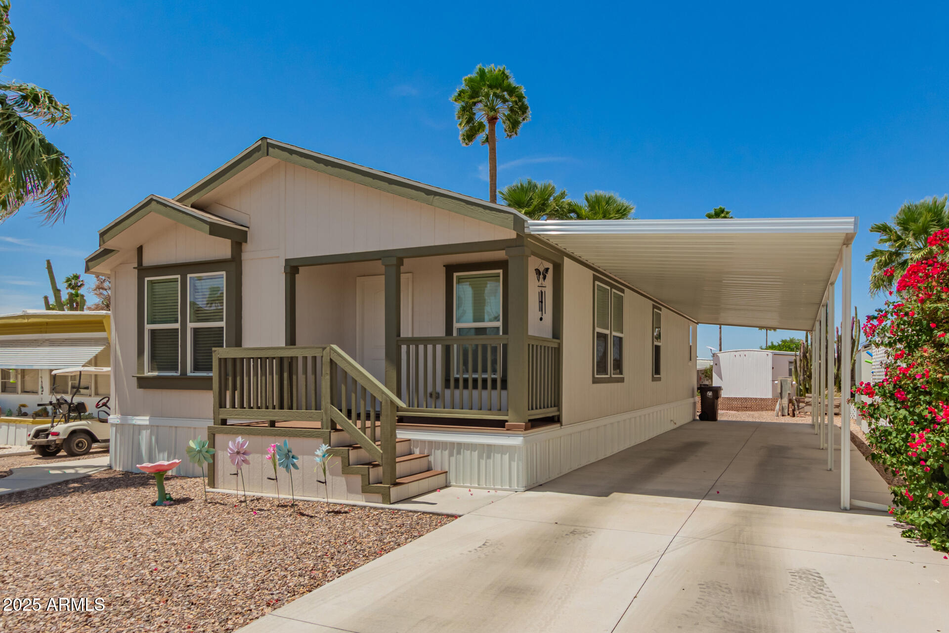 10540 East Apache Trail, Unit 50 Apache Junction, AZ 85120 - Photo 9 of 32 a front view of a house with a yard