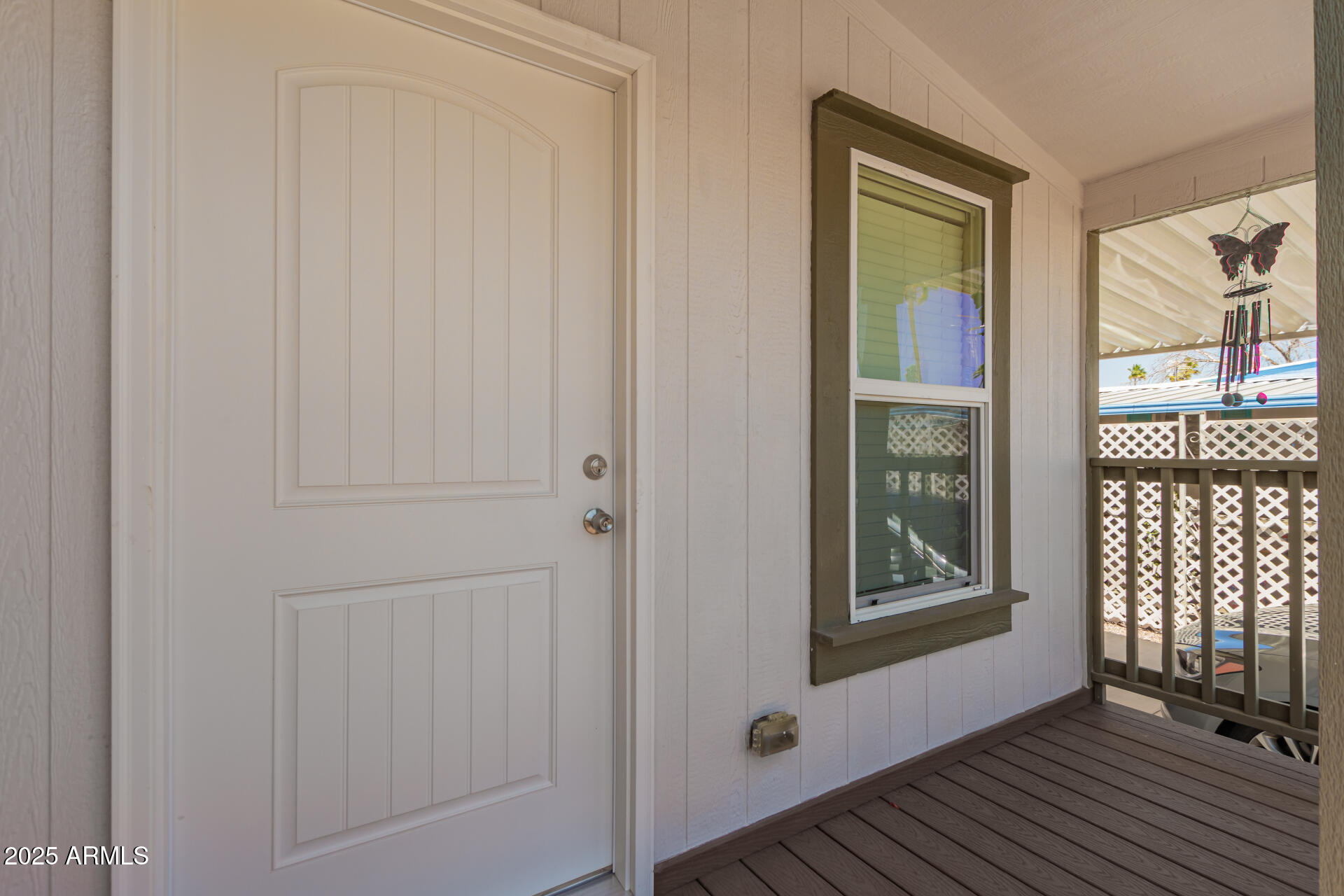 10540 East Apache Trail, Unit 50 Apache Junction, AZ 85120 - Photo 10 of 32 a view of a hallway with wooden floor and a window