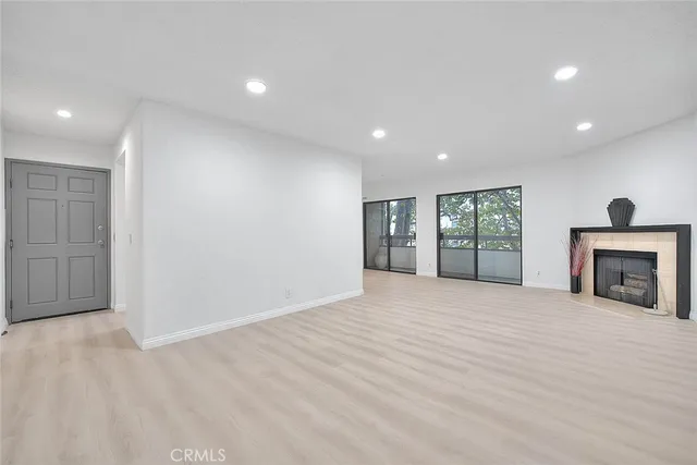 a view of a kitchen with a sink and a stove top oven