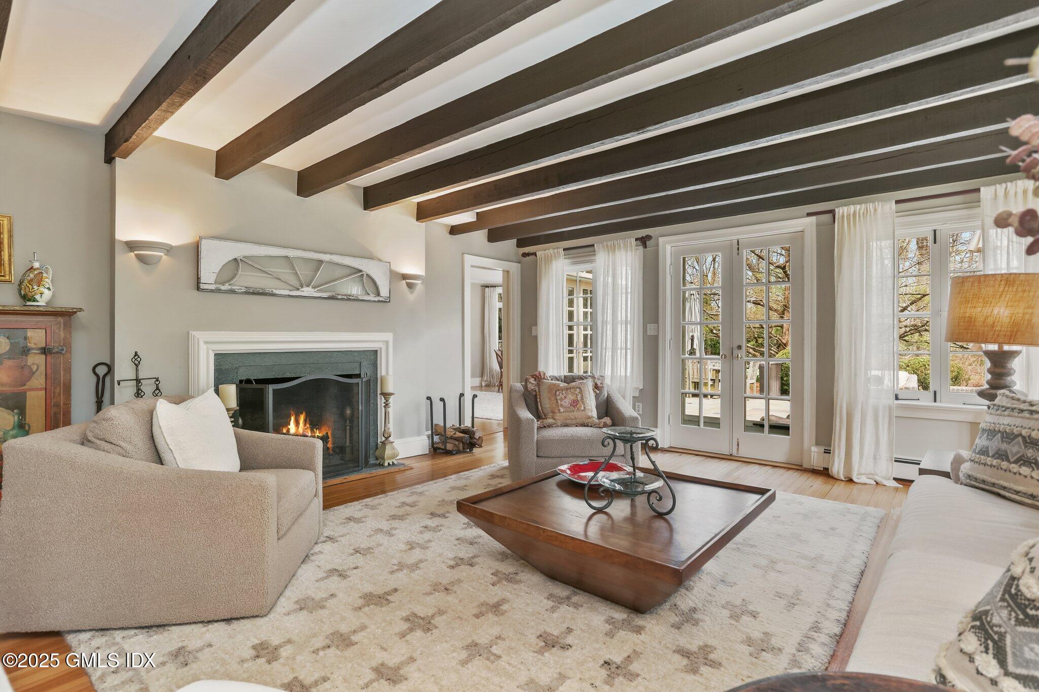 1007 King Street Greenwich, CT 06831 - Photo 12 of 71 a living room with furniture and a fireplace