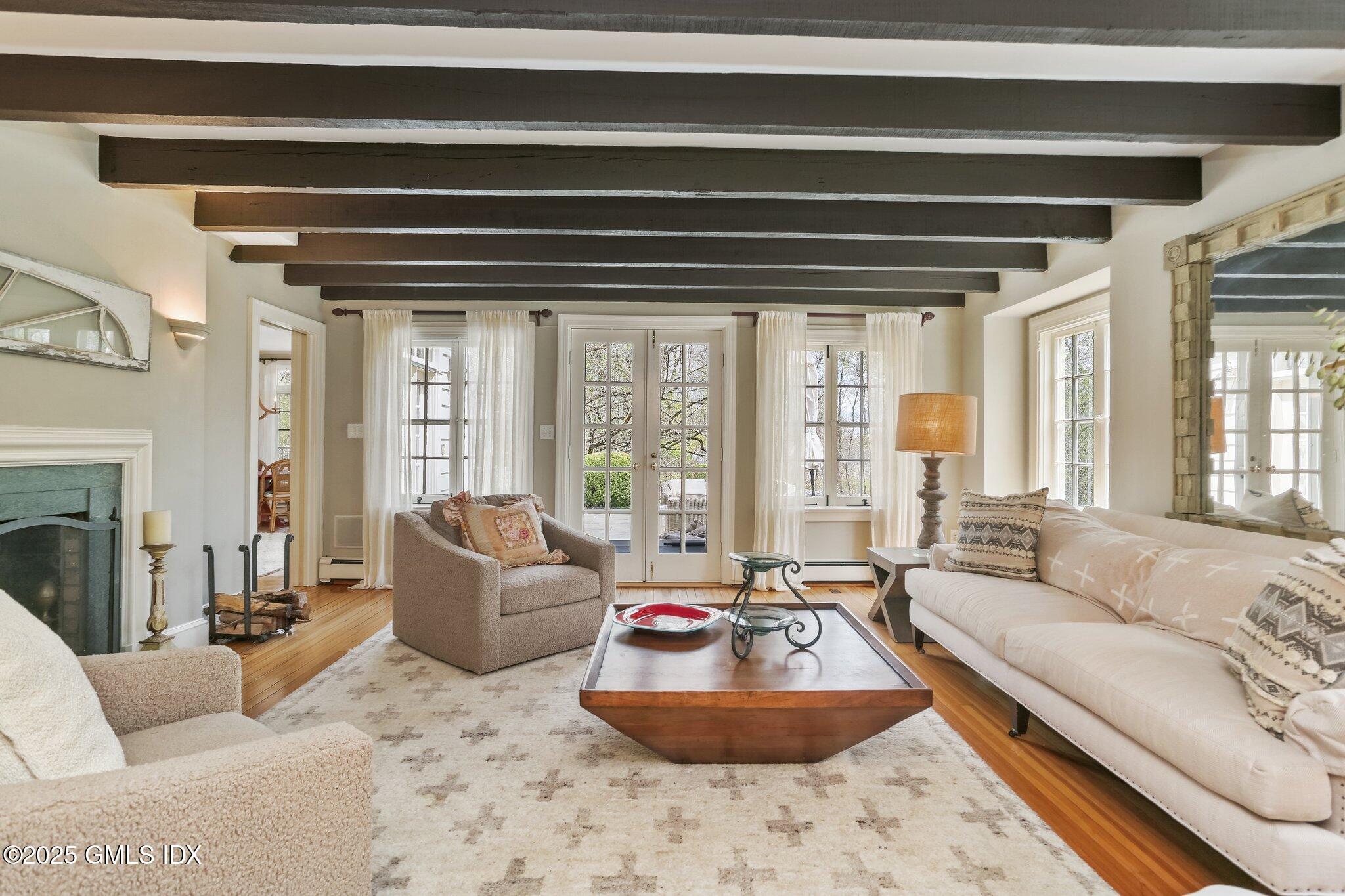 1007 King Street Greenwich, CT 06831 - Photo 13 of 71 a living room with furniture and a large window