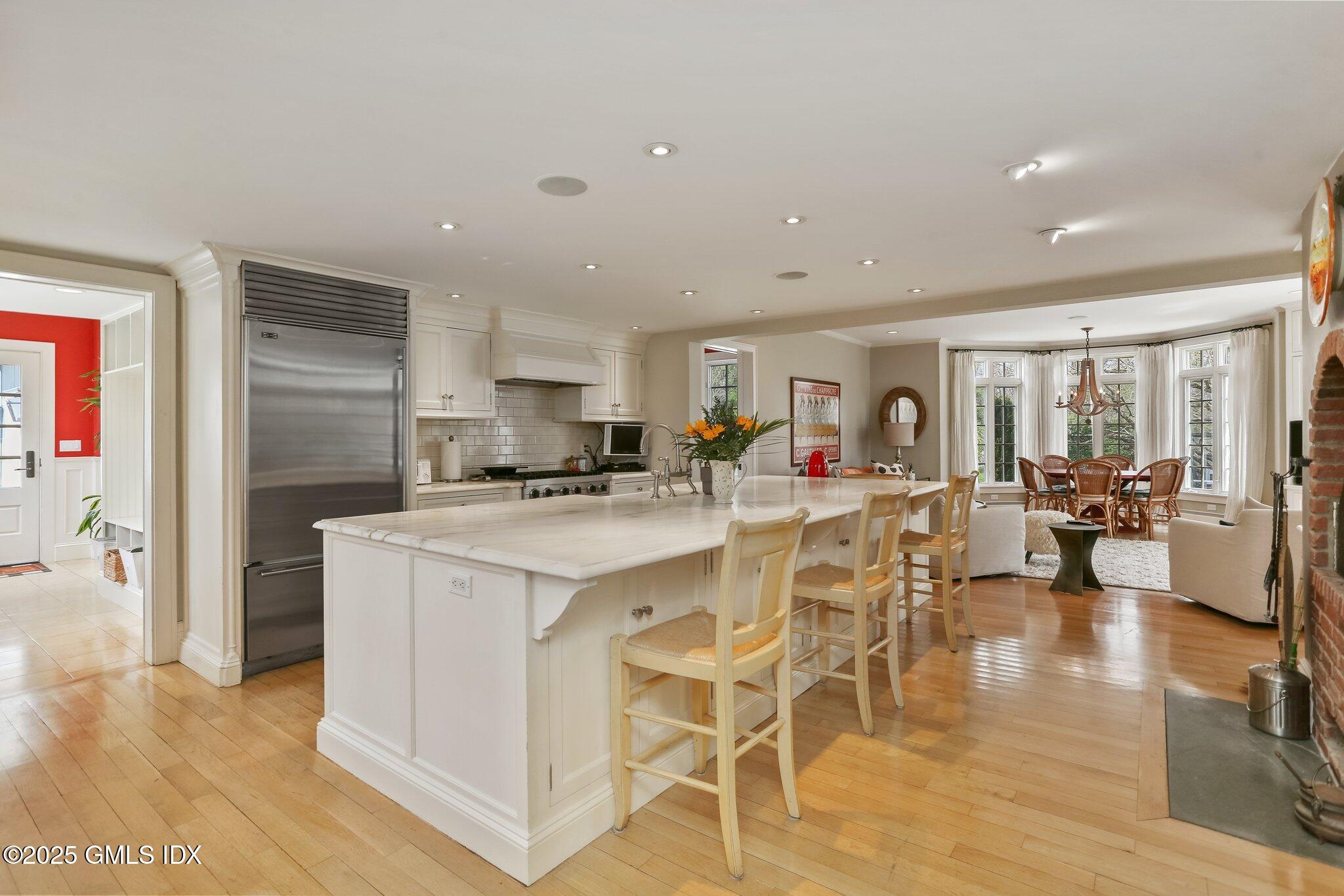 1007 King Street Greenwich, CT 06831 - Photo 21 of 71 a kitchen with stainless steel appliances kitchen island granite countertop a refrigerator and cabinets