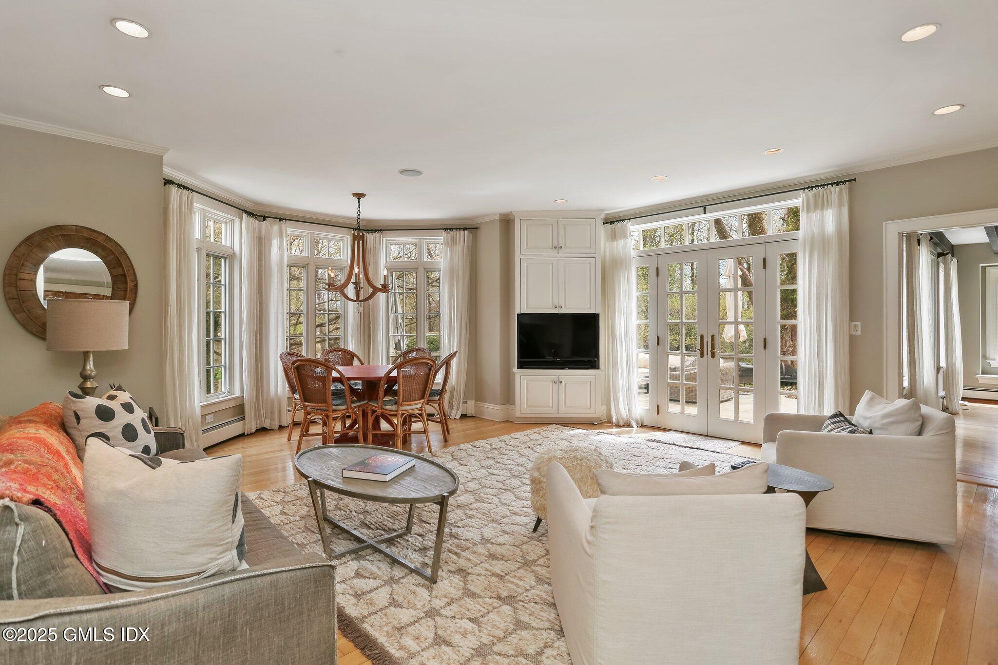 1007 King Street Greenwich, CT 06831 - Photo 23 of 71 a living room with furniture and a large window