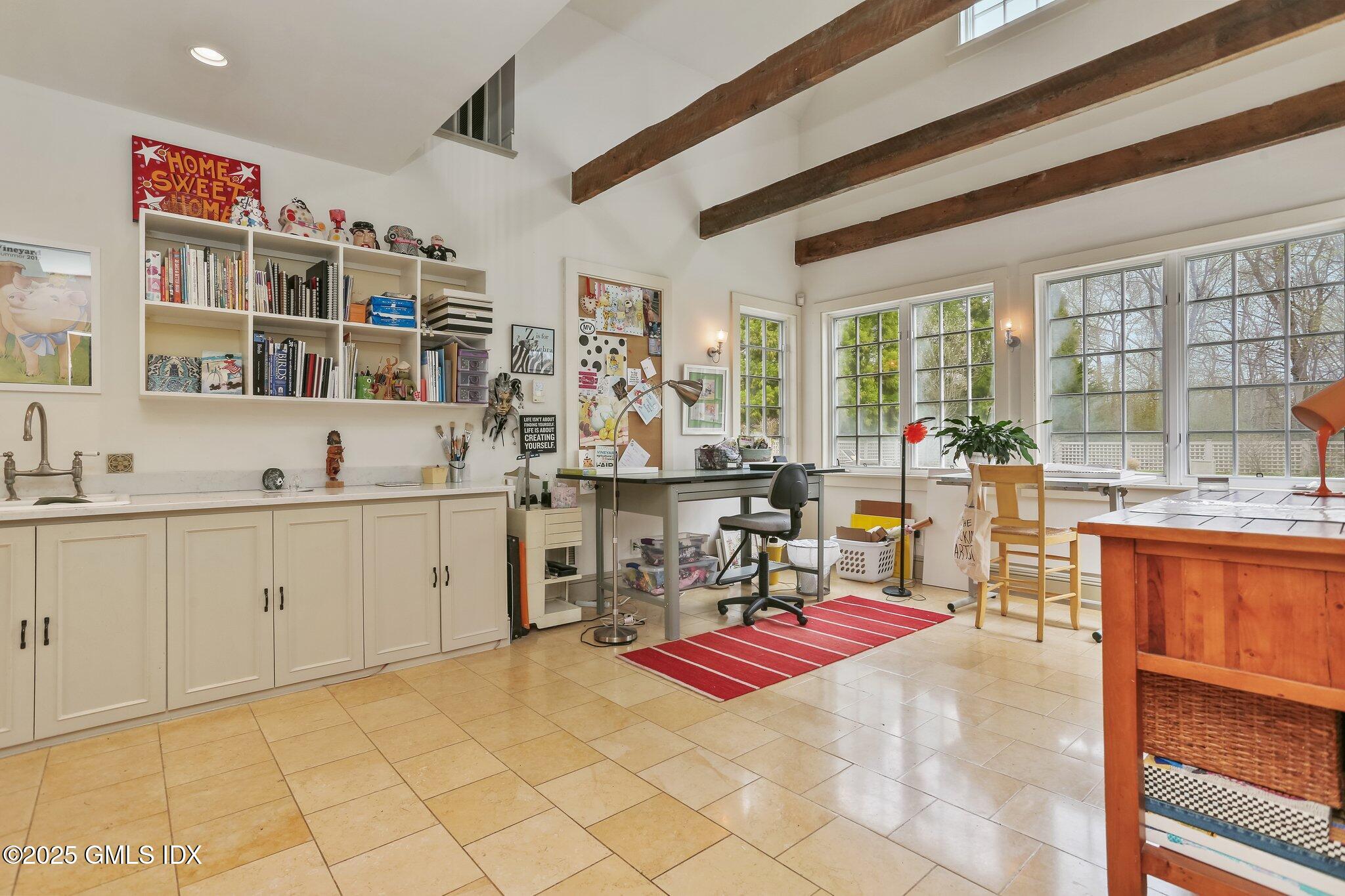 1007 King Street Greenwich, CT 06831 - Photo 30 of 71 a room with stainless steel appliances kitchen island granite countertop a sink and cabinets