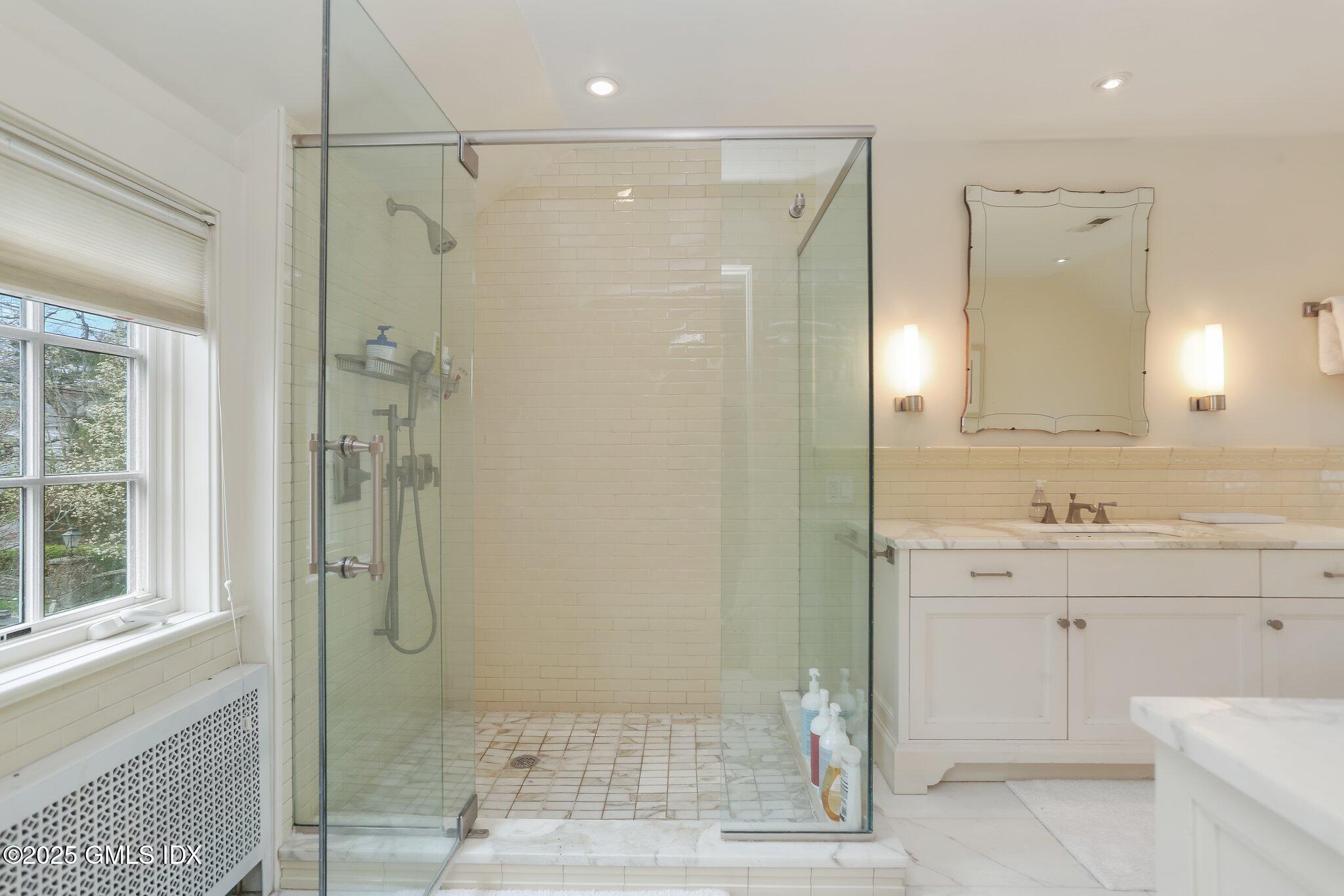 1007 King Street Greenwich, CT 06831 - Photo 38 of 71 a bathroom with a shower and a sink