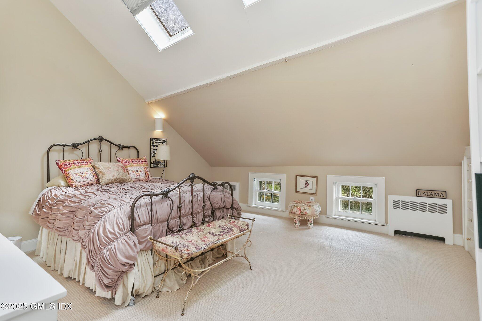 1007 King Street Greenwich, CT 06831 - Photo 42 of 71 a bedroom with a bed and a couch