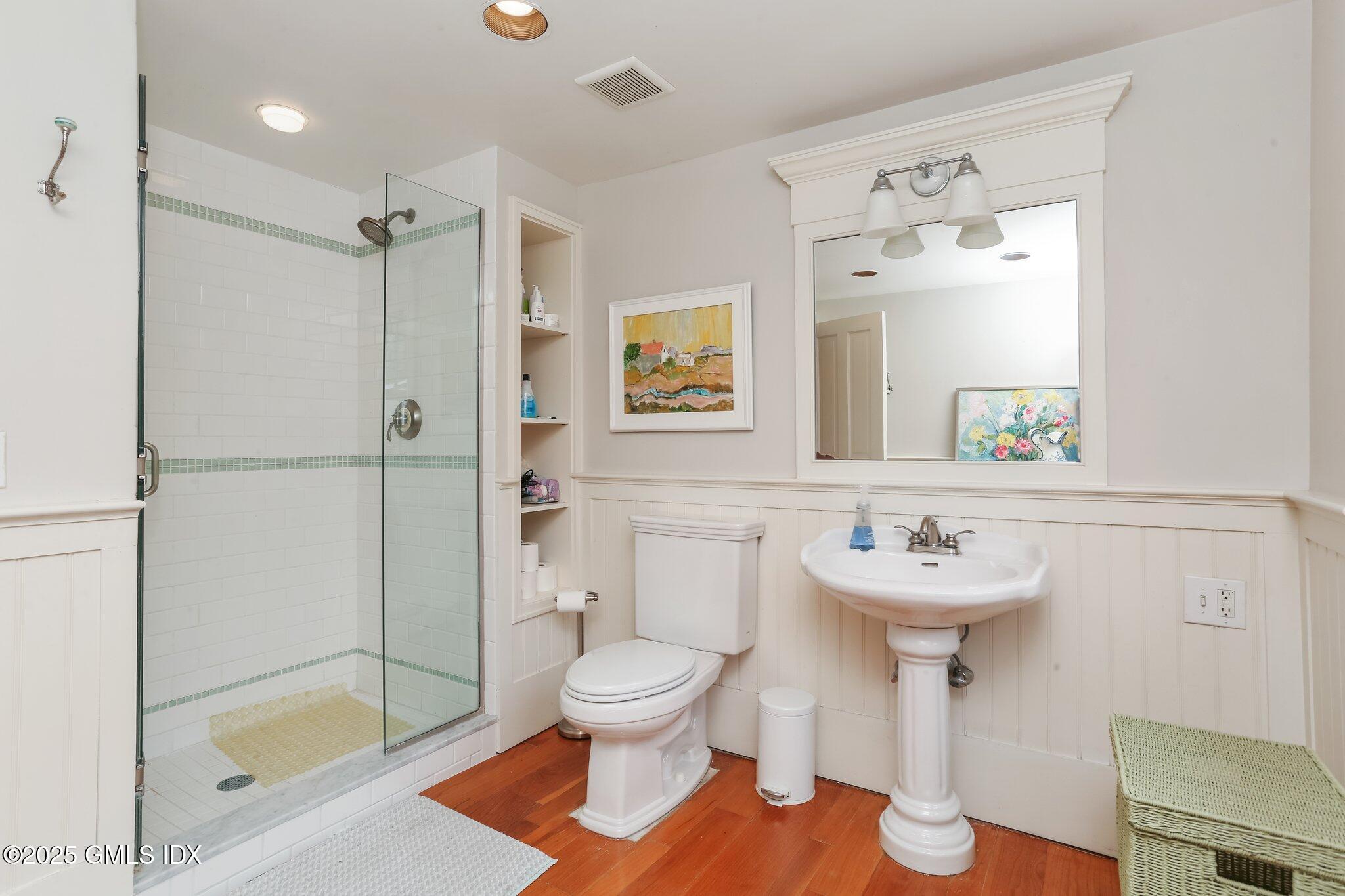 1007 King Street Greenwich, CT 06831 - Photo 46 of 71 a bathroom with a sink toilet and shower