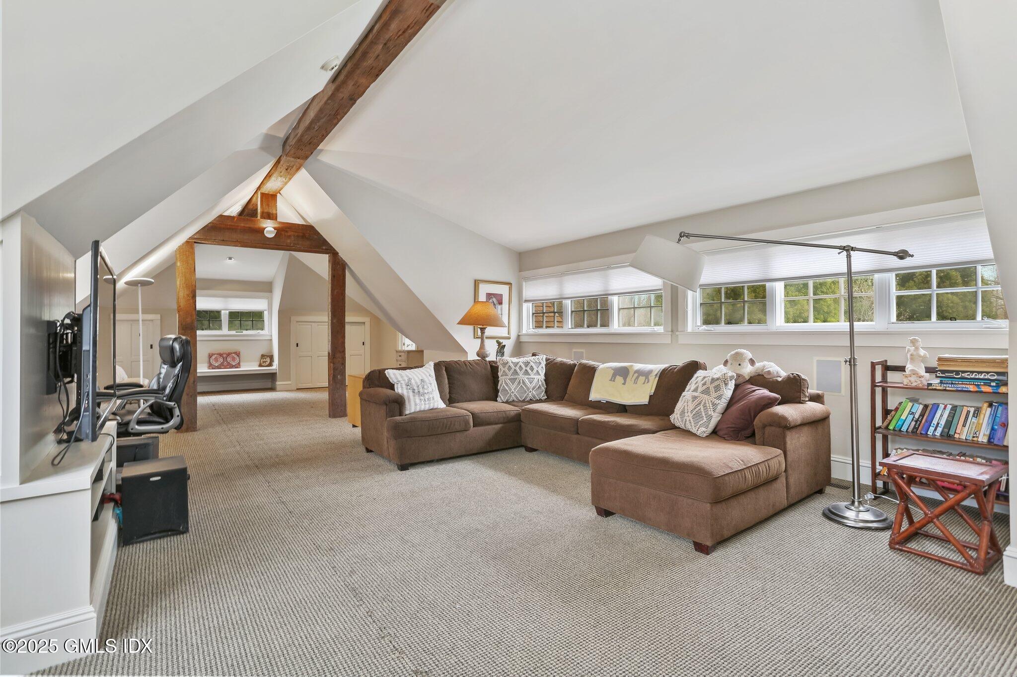 1007 King Street Greenwich, CT 06831 - Photo 50 of 71 a living room with furniture and a flat screen tv