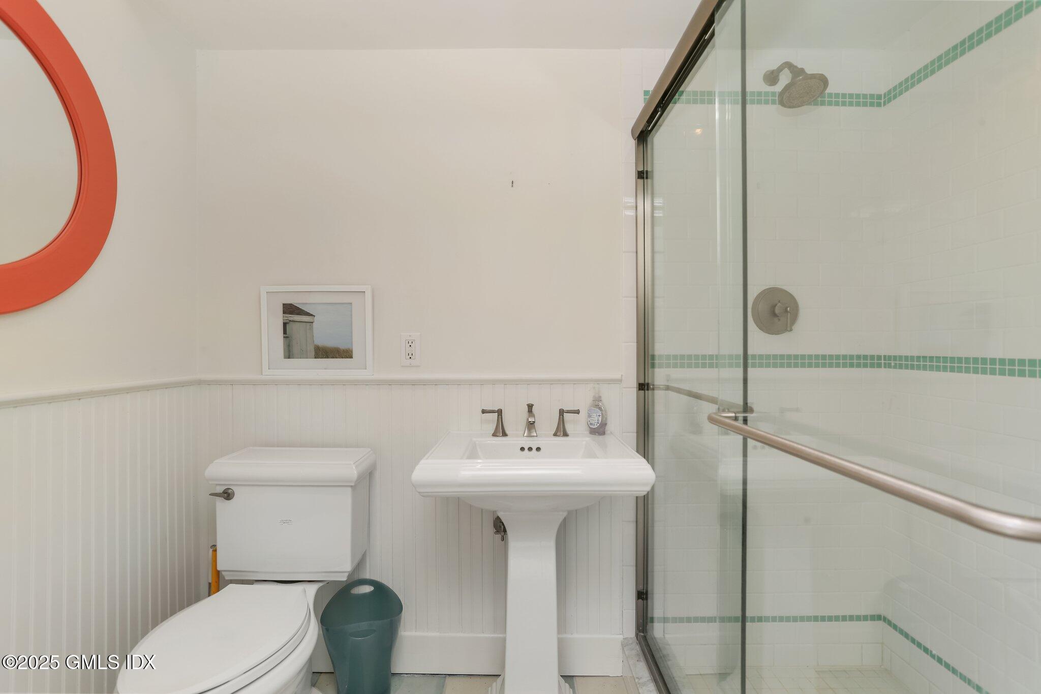 1007 King Street Greenwich, CT 06831 - Photo 53 of 71 a bathroom with a sink toilet and shower