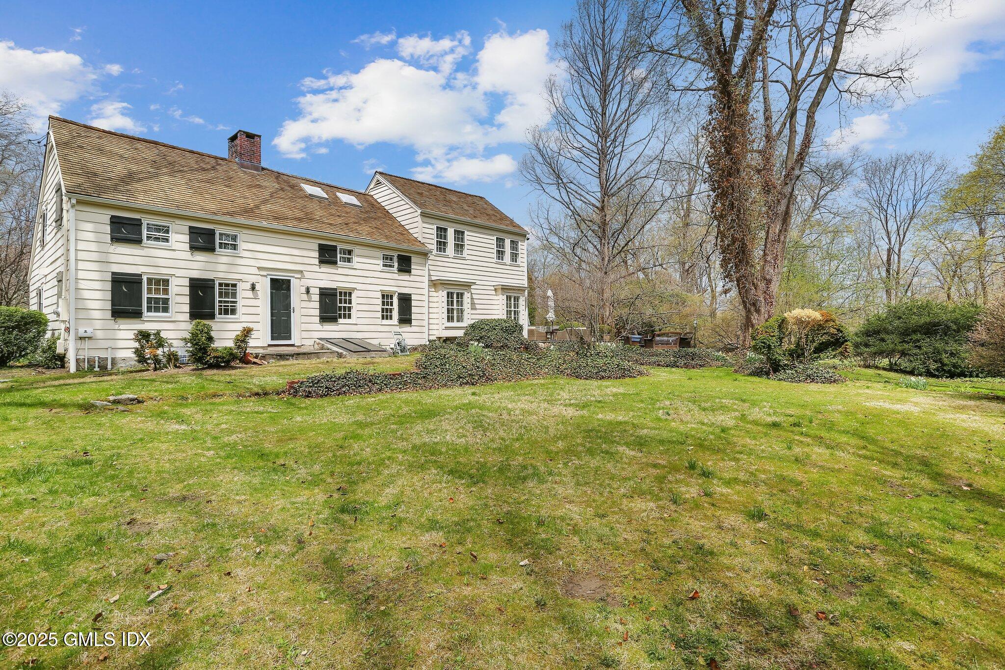1007 King Street Greenwich, CT 06831 - Photo 57 of 71 a front view of house with yard and green space