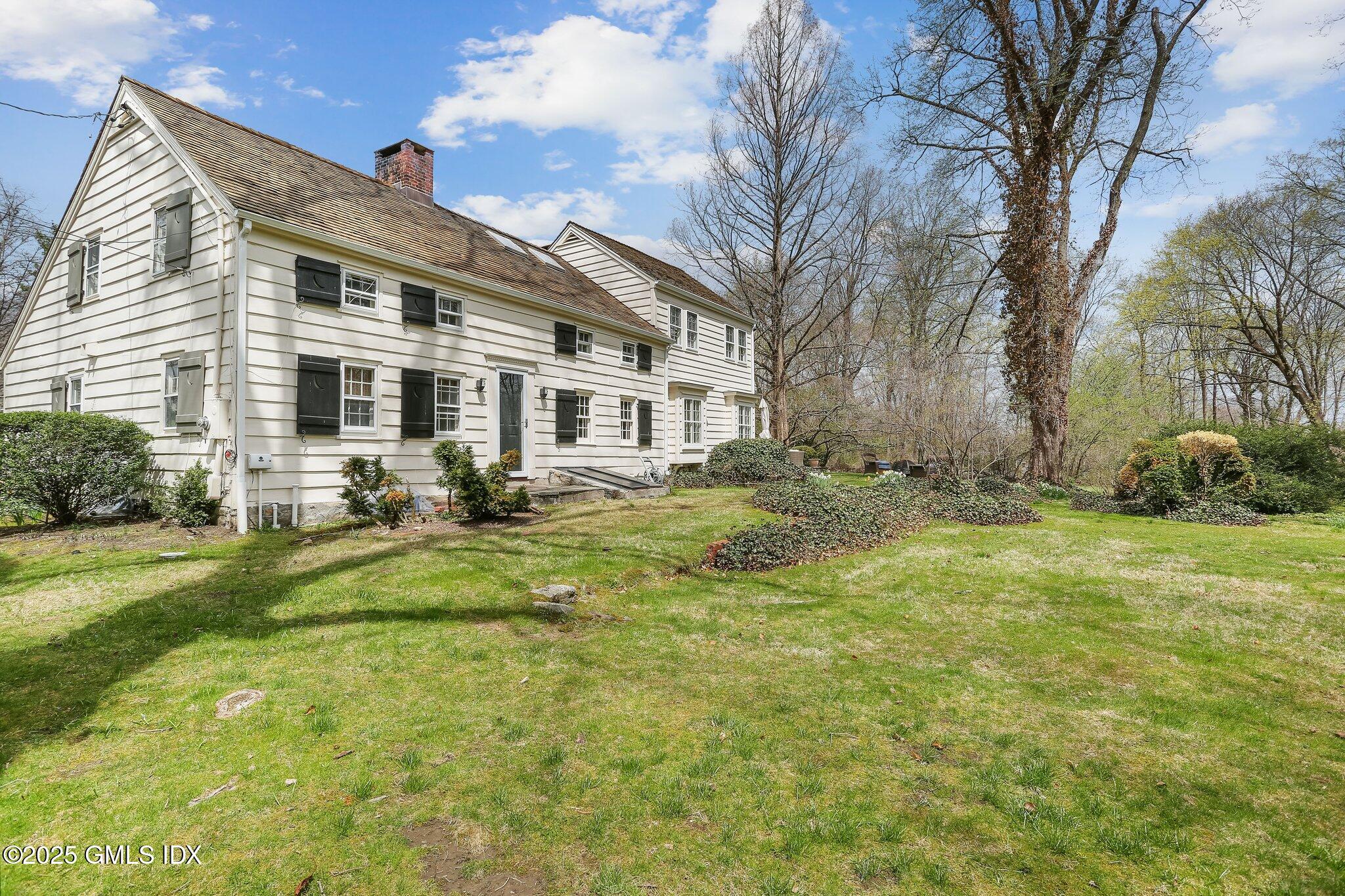 1007 King Street Greenwich, CT 06831 - Photo 58 of 71 a front view of house with yard