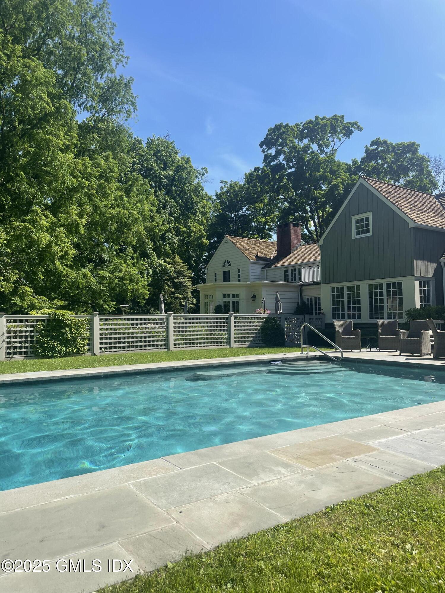 1007 King Street Greenwich, CT 06831 - Photo 66 of 71 a view of a house with a big yard