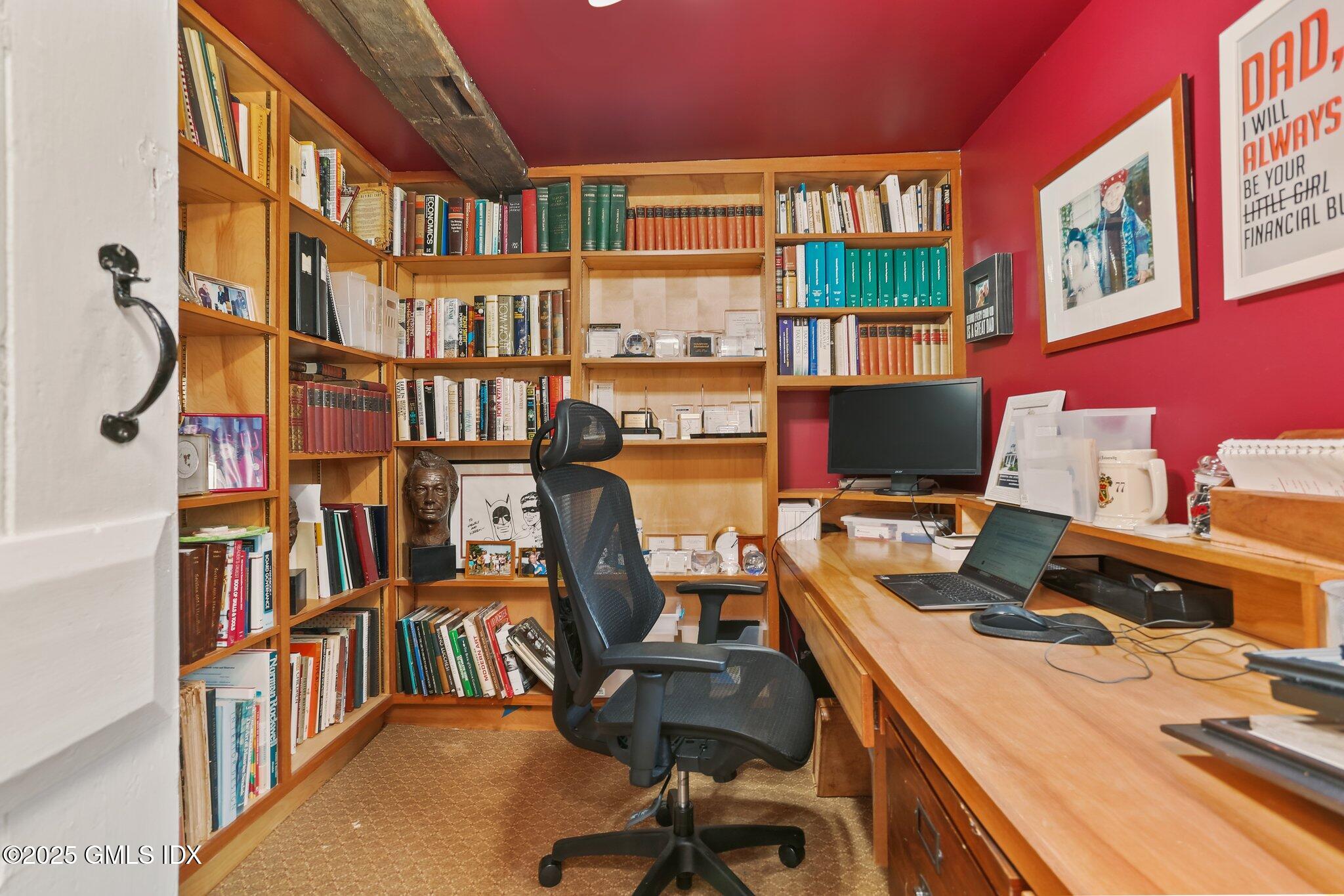 1007 King Street Greenwich, CT 06831 - Photo 8 of 71 a view of a workspace with furniture and a bookshelf