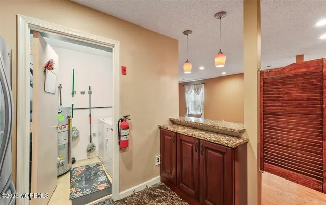 a view of a hallway with washer and dryer