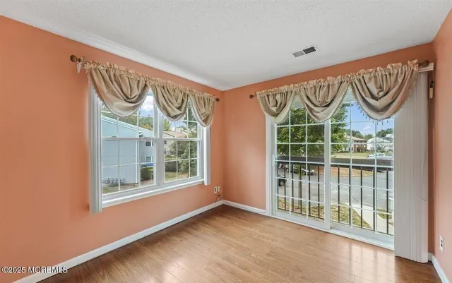 a view of a entryway door with wooden floor