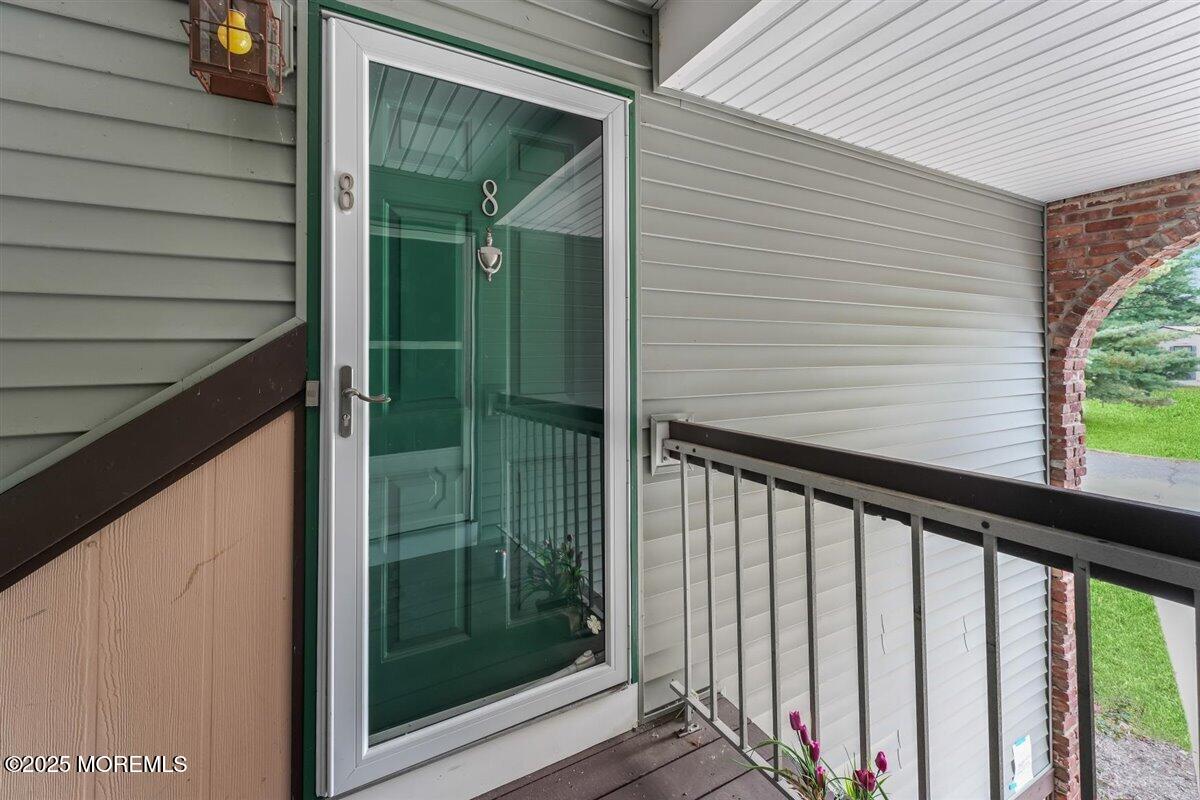 19 Augusta Court, Unit 8 Freehold, NJ 07728 - Photo 4 of 27 a view of a balcony