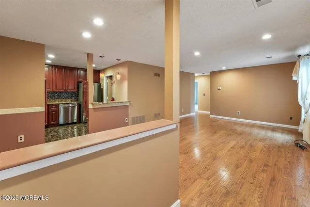 a kitchen with stainless steel appliances a refrigerator and a counter top
