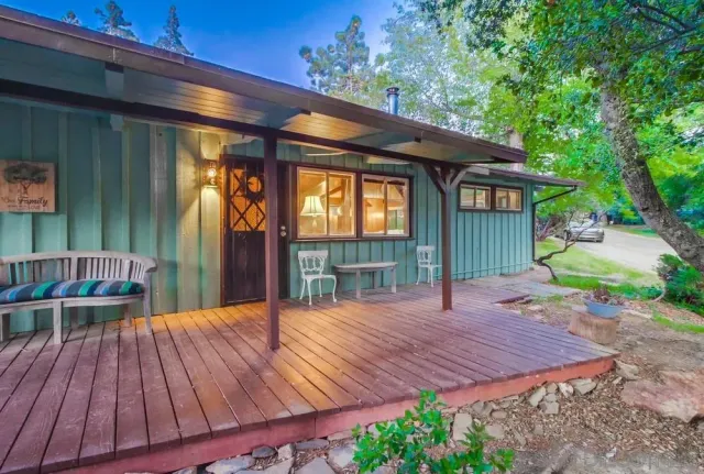 a view of a house with porch and wooden floor