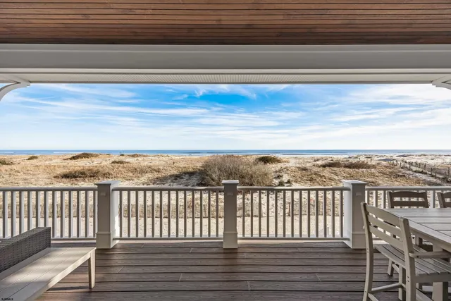 a living room with furniture a wooden floor and next to a window