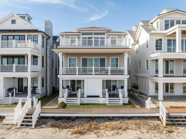 a front view of a house with a iron gate