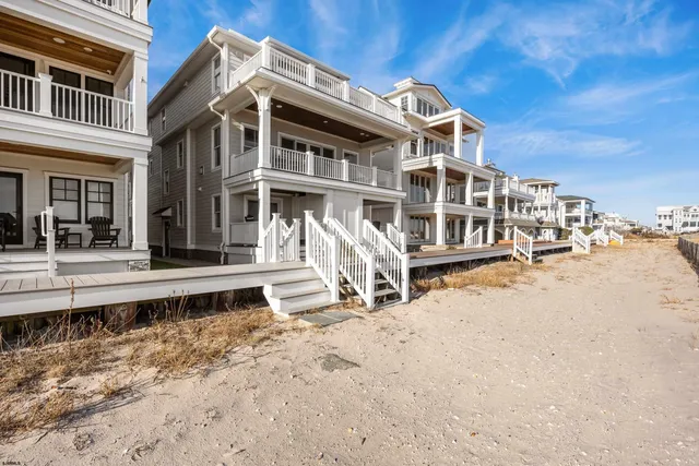 a living room with fireplace furniture and a floor to ceiling window