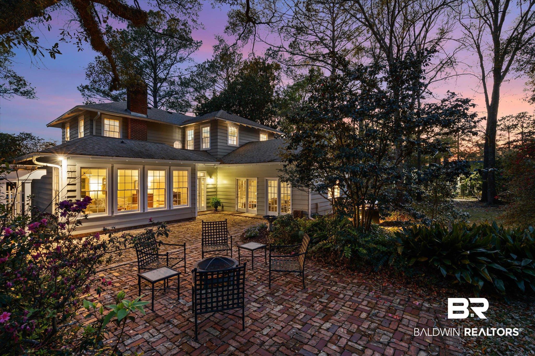 2 Westgate Road Mobile, AL 36608 - Photo 2 of 63 Rear view of property featuring a fire pit, a patio, roof with shingles, and a chimney