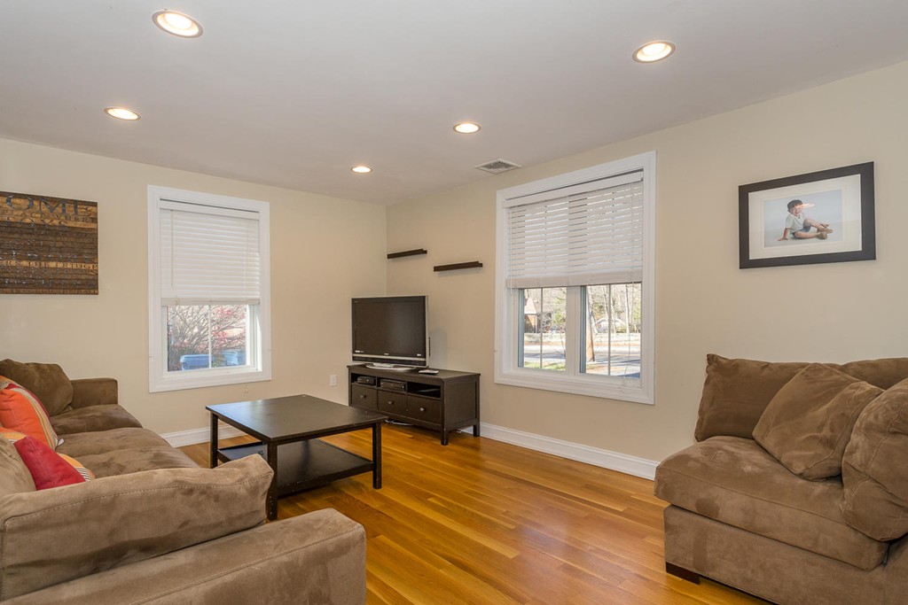 136 Sherman Street Canton, MA 02021 - Photo 3 of 17 a living room with furniture a window and a flat screen tv