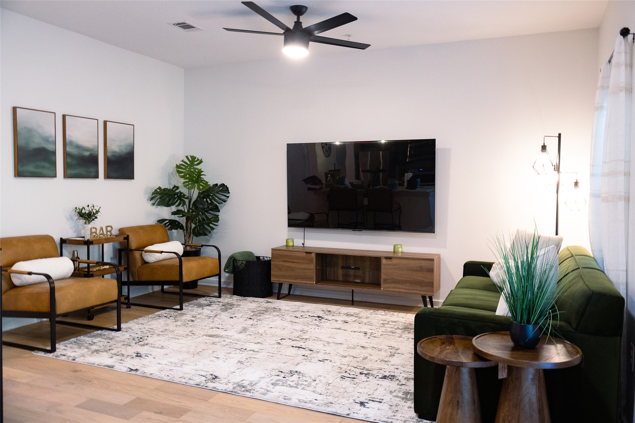 a living room with furniture and a flat screen tv
