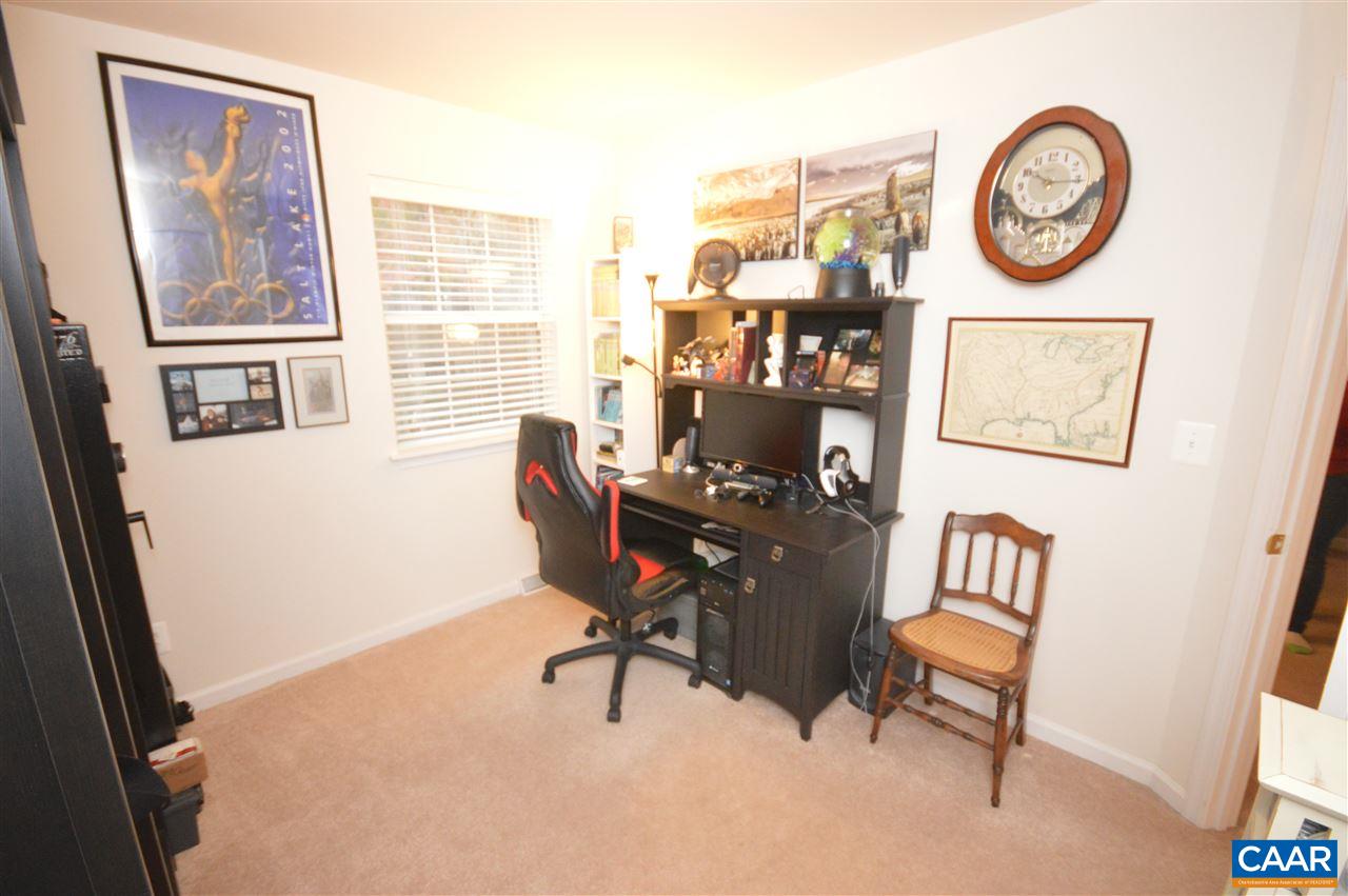 1574 Cool Spring Road Charlottesville, VA 22901 - Photo 17 of 23 a view of a workspace with furniture and a window