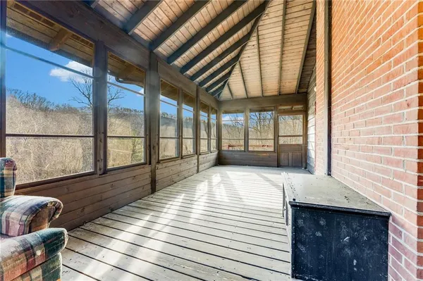 a view of an entryway with wooden floor