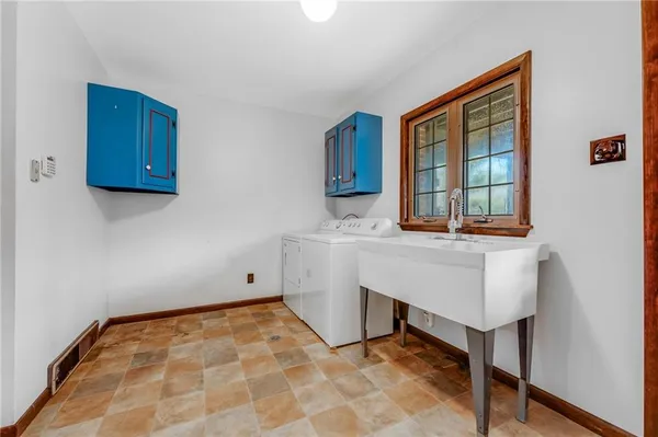 a room with table chair and window