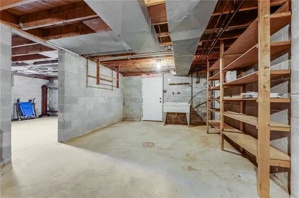 a view of an empty room with storage