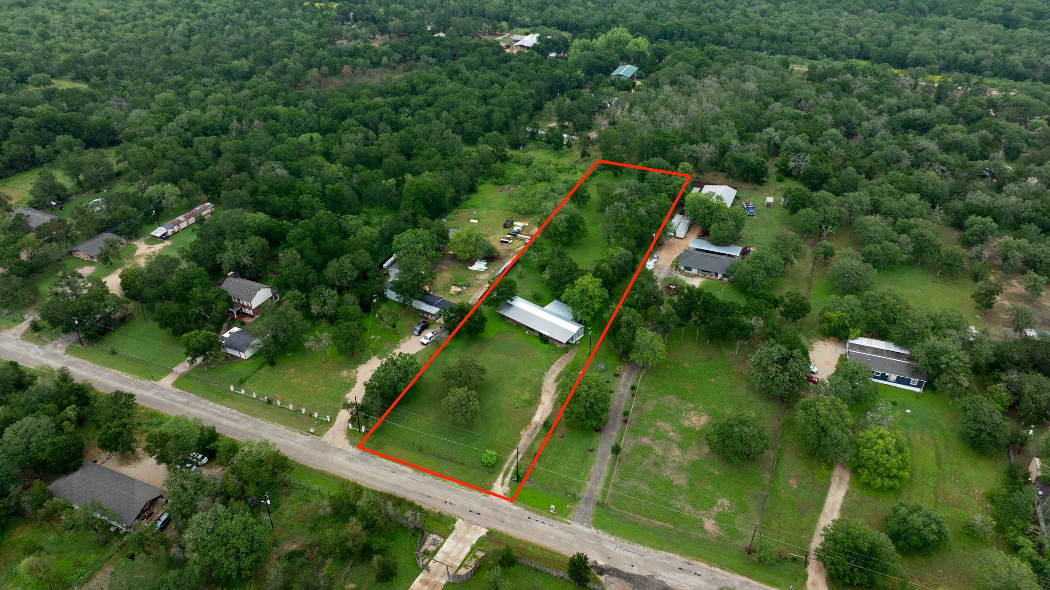288 The Forest Road Dale, TX 78616 - Photo 1 of 31 a bird view of a garden