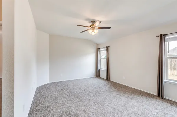 a view of a big room with carpet
