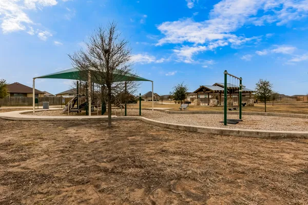 a view of a yard with a slide