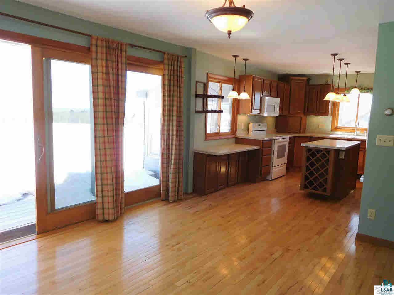 25805 Cozy Corner Road Ashland, WI 54806 - Photo 3 of 25 Dining Room W/Patio Facing Lake