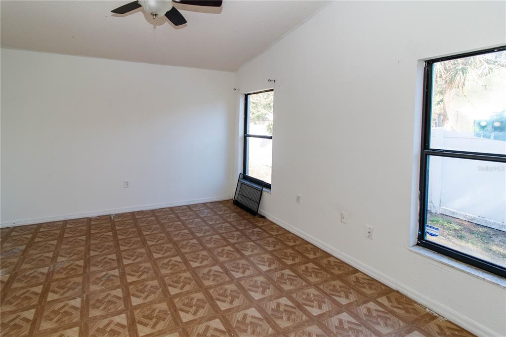 11339 Dean Street Spring Hill, FL 34608 - Photo 13 of 33 an empty room with windows