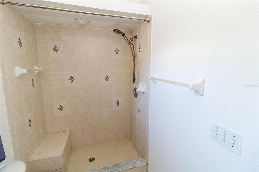 11339 Dean Street Spring Hill, FL 34608 - Photo 15 of 33 a bathroom with a shower