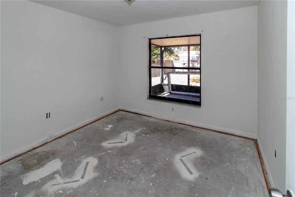 11339 Dean Street Spring Hill, FL 34608 - Photo 18 of 33 an empty room with a window