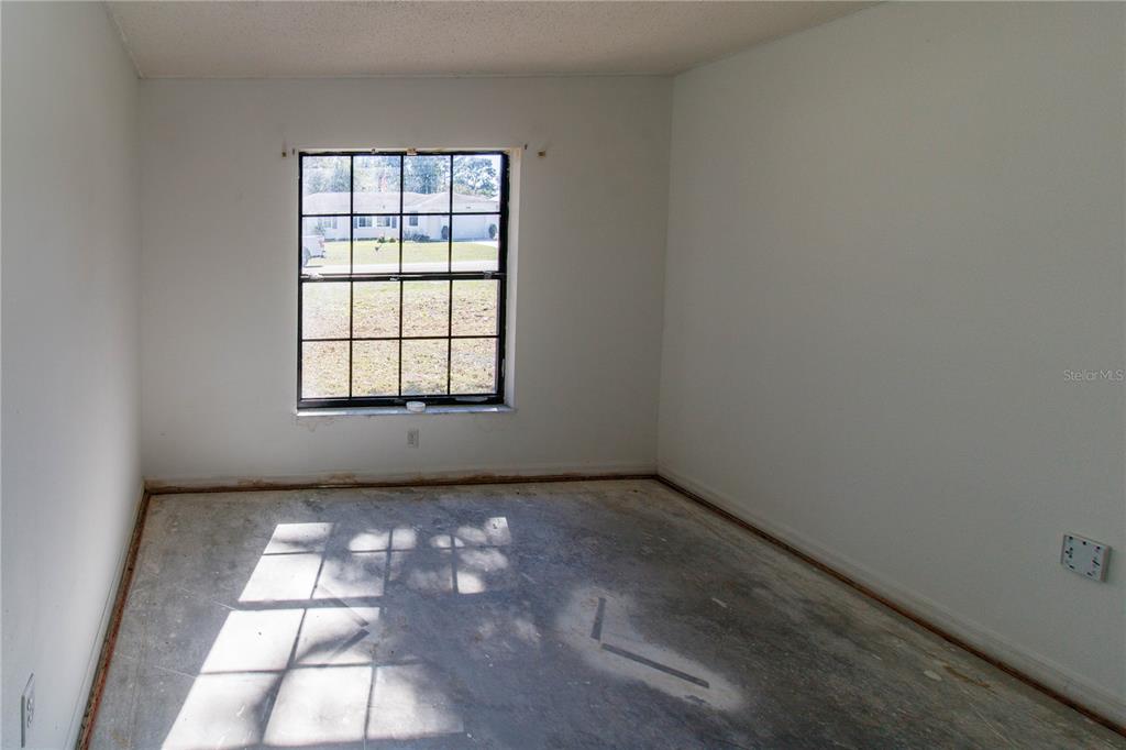 11339 Dean Street Spring Hill, FL 34608 - Photo 26 of 33 an empty room with windows