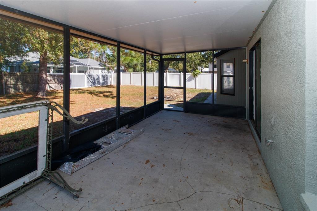 11339 Dean Street Spring Hill, FL 34608 - Photo 27 of 33 a view of an empty room with windows