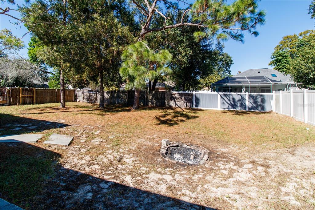 11339 Dean Street Spring Hill, FL 34608 - Photo 29 of 33 a view of a yard with chairs