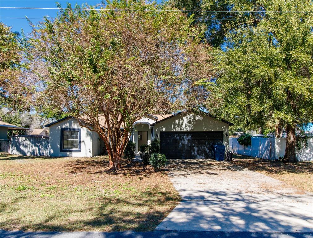 11339 Dean Street Spring Hill, FL 34608 - Photo 4 of 33 a front view of a house with a yard
